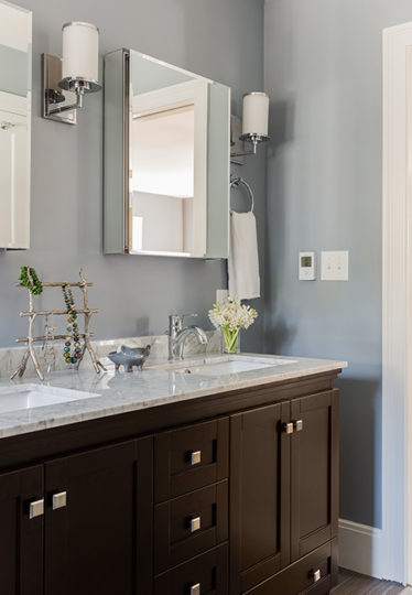 New mirrors and sconces in bathroom remodel in Belmont, MA