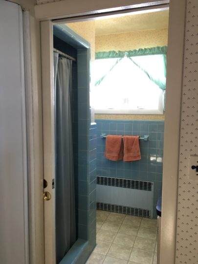 Outdated tile bathroom in Waltham, MA