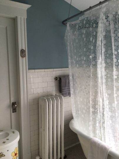 Old cast iron tub before bathroom remodel in Newton, MA