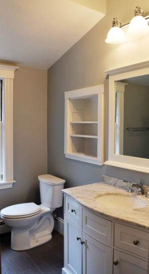 Gray and white bathroom remodel in Newton, MA