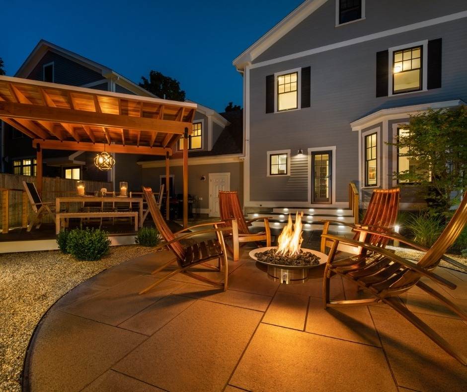 outdoor area with firepit at night