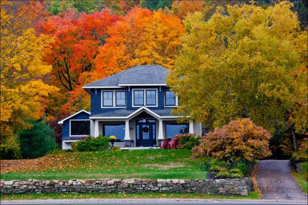 House surrounded by fall leaves